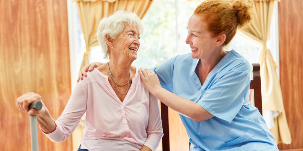 old woman smiling at caregiver