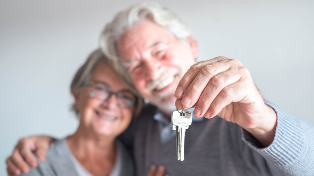 Elderly Parents holding a key to their home